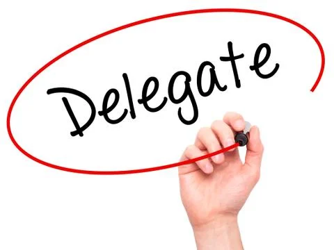 Man Hand writing Delegate with black marker on visual screen Stock Photos