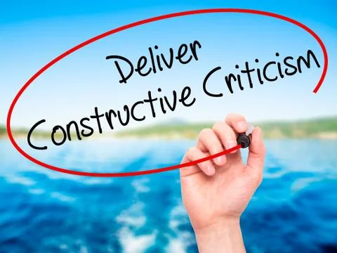 Man Hand writing Deliver Constructive Criticism with black marker on visual s Stock Photos