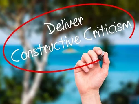 Man Hand writing Deliver Constructive Criticism with black marker on visual s Foto stock