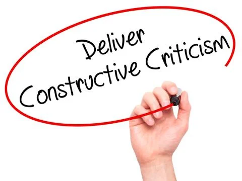 Man Hand writing Deliver Constructive Criticism with black marker on visual s Stock Photos