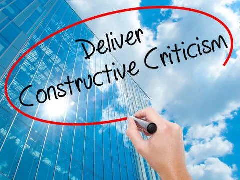 Man Hand writing Deliver Constructive Criticism with black marker on visual s Stock Photos