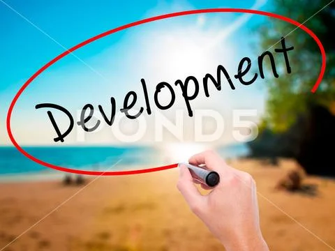 Man Hand writing Development with black marker on visual screen Stock Photos
