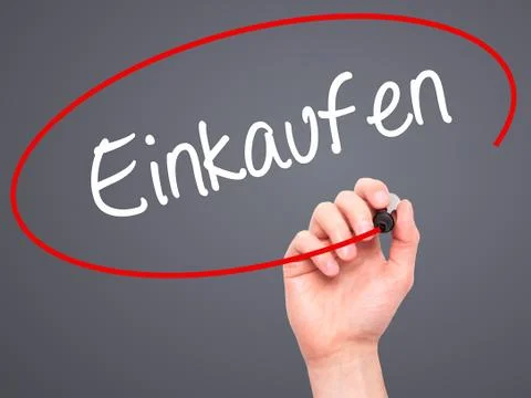 Man Hand writing Einkaufen (Shopping in German) with black marker Stock Photos