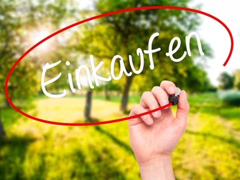 Man Hand writing Einkaufen (Shopping in German) with black marker Stock Photos
