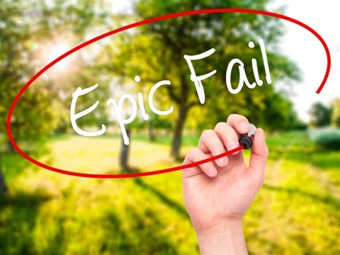 Man Hand writing Epic Fail with black marker on visual screen Stock Photos