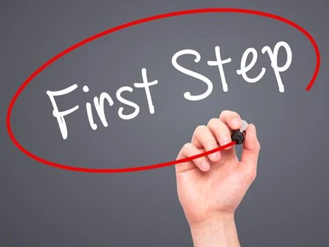 Man Hand writing First Step  with black marker on visual screen Stock Photos