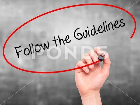 Man Hand writing Follow the Guidelines with black marker on vis Stock Photos