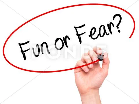 Man Hand writing Fun or Fear? with black marker on visual screen ~ Hi ...