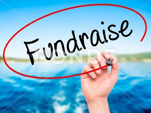 Man Hand writing Fundraise with black marker on visual screen Stock Photos
