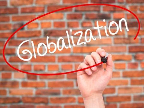 Man Hand writing Globalization with black marker on visual screen. Stock Photos