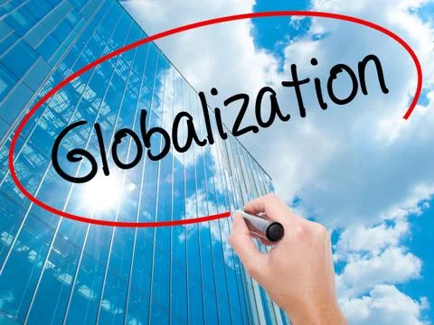 Man Hand writing Globalization with black marker on visual screen. Stock Photos