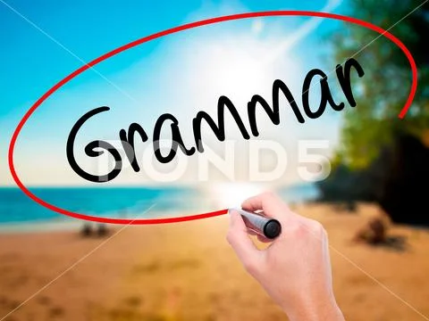 Man Hand writing Grammar with black marker on visual screen Stock Photos
