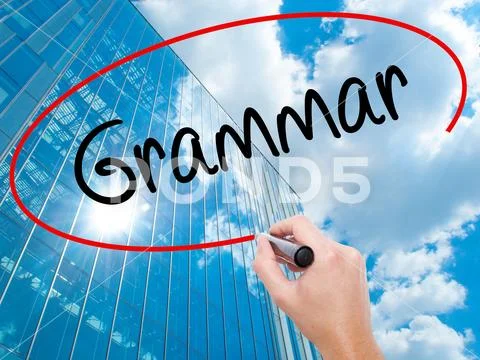 Man Hand writing Grammar with black marker on visual screen Stock Photos