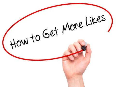 Man Hand writing How to Get More Likes? with black marker on visual screen Photos