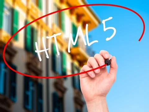 Man Hand writing HTML 5 with black marker on visual screen Foto stock