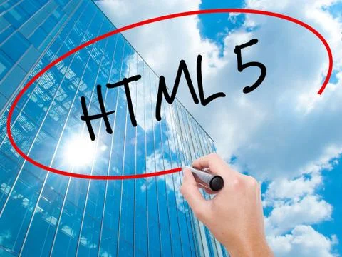 Man Hand writing HTML 5 with black marker on visual screen Stock Photos