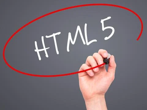 Man Hand writing HTML 5 with black marker on visual screen Stock Photos