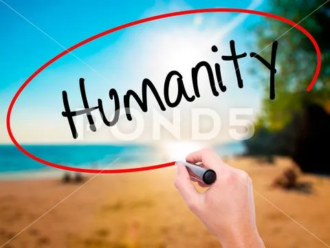 Man Hand writing Humanity with black marker on visual screen Stock Photos
