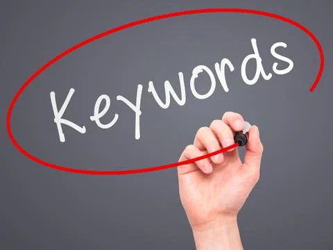 Man hand writing Keywords on visual screen 写真素材