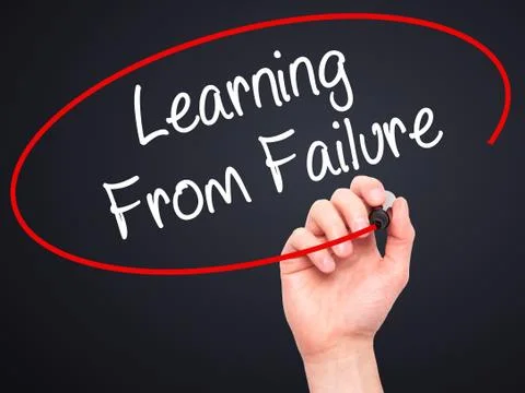 Man Hand writing Learning From Failure with black marker on visual screen. Stock Photos