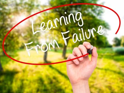 Man Hand writing Learning From Failure with black marker on visual screen. Stock Photos