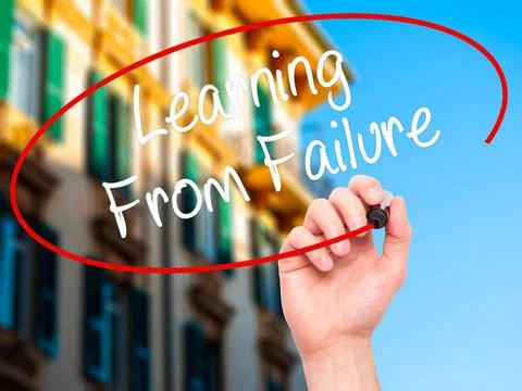 Man Hand writing Learning From Failure with black marker on visual screen.... Stock Photos