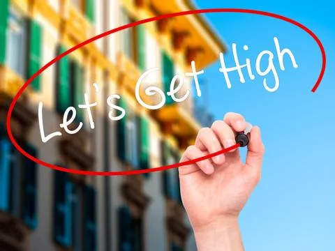 Man Hand writing Let's Get High with black marker on visual screen Stock Photos