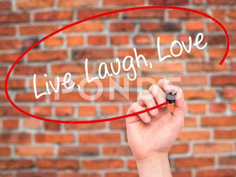 Man Hand writing Live Laugh Love with black marker on visual screen. Stock Illustration