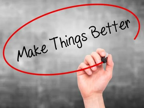 Man Hand writing   Make Things Better with black marker on visual screen Stock Photos