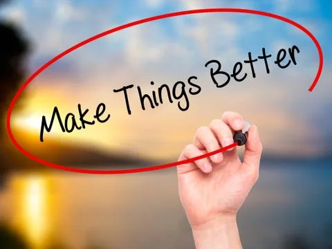 Man Hand writing   Make Things Better with black marker on visual screen Foto stock