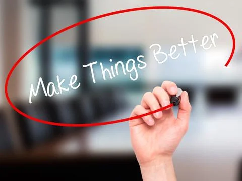 Man Hand writing   Make Things Better with black marker on visual screen Stock Photos