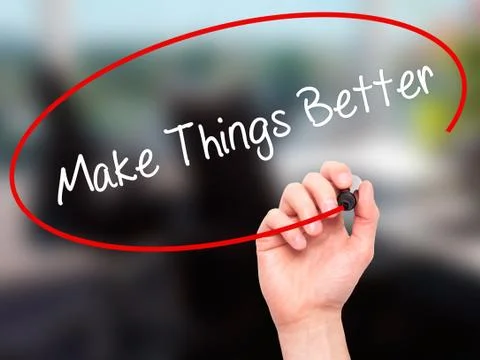 Man Hand writing   Make Things Better with black marker on visual screen Foto stock