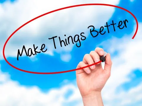 Man Hand writing   Make Things Better with black marker on visual screen Foto stock