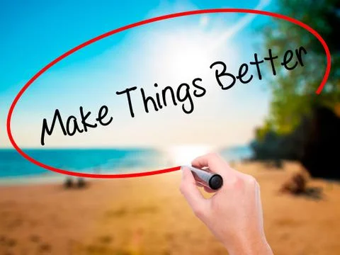 Man Hand writing   Make Things Better with black marker on visua Foto stock