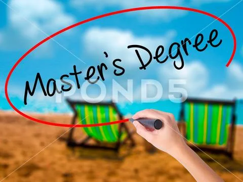 Man Hand writing Master's Degree with black marker on visual scr Stock Photos