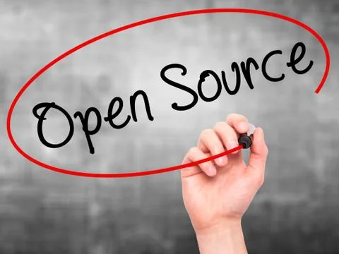 Man Hand writing Open Source with black marker on visual screen Stock Photos