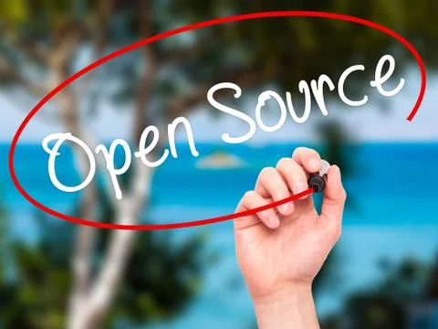 Man Hand writing Open Source with black marker on visual screen Stock Photos