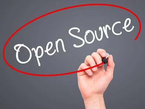 Man Hand writing Open Source with black marker on visual screen Stock Photos