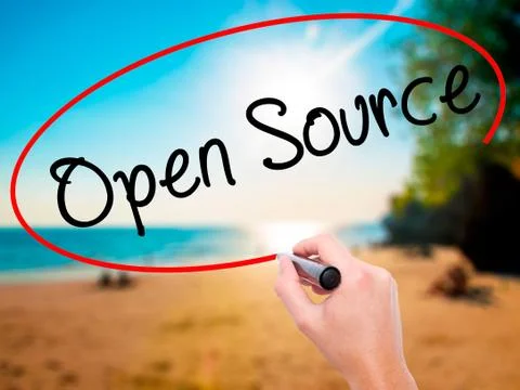 Man Hand writing Open Source with black marker on visual screen Stock Photos