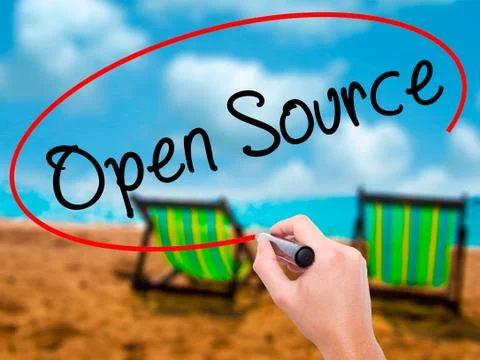 Man Hand writing Open Source with black marker on visual screen Stock Photos