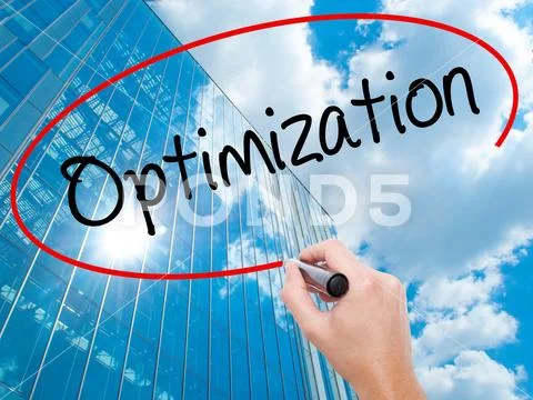 Man Hand writing Optimization with black marker on visual scree Stock Photos