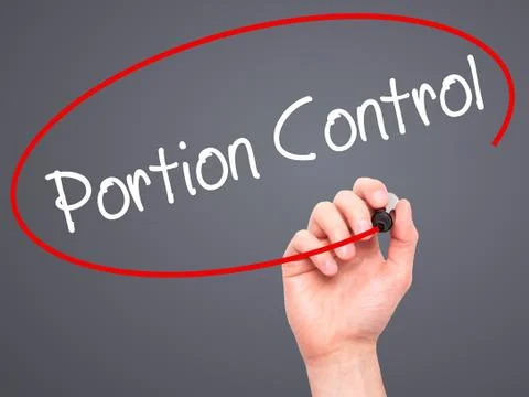 Man Hand writing Portion Control with black marker on visual screen Stock Photos