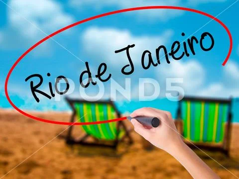 Man Hand writing Rio de Janeiro with black marker on visual scre Stock Photos