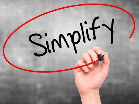 Man Hand writing Simplify with black marker on visual screen Stock Photos