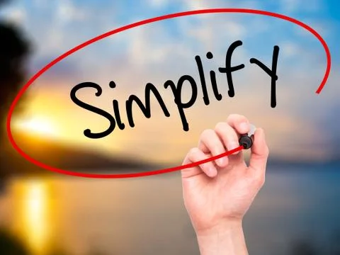 Man Hand writing Simplify with black marker on visual screen Stock Photos
