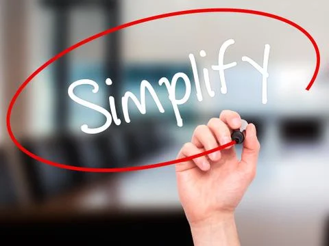 Man Hand writing Simplify with black marker on visual screen Stock Photos