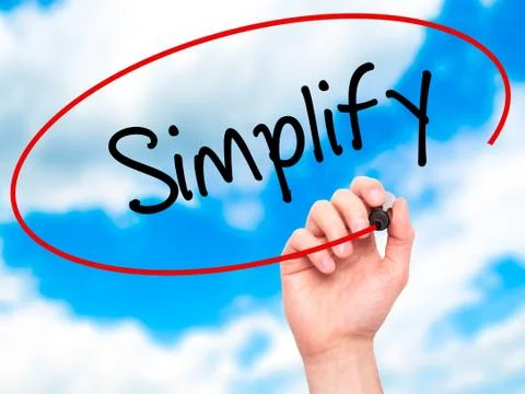 Man Hand writing Simplify with black marker on visual screen Stock Photos