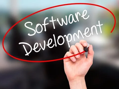Man Hand writing Software Development with black marker on visual screen Stock Photos