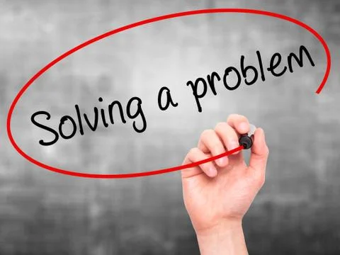 Man Hand writing Solving a problem with black marker on visual screen Foto stock