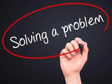 Man Hand writing Solving a problem with black marker on visual screen Foto stock